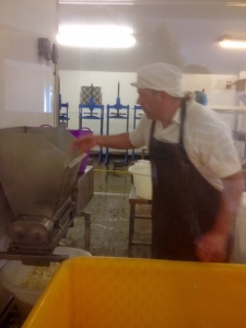 Graham Kirkham prepares to mill curd from 2 days to pack into the moulds.
